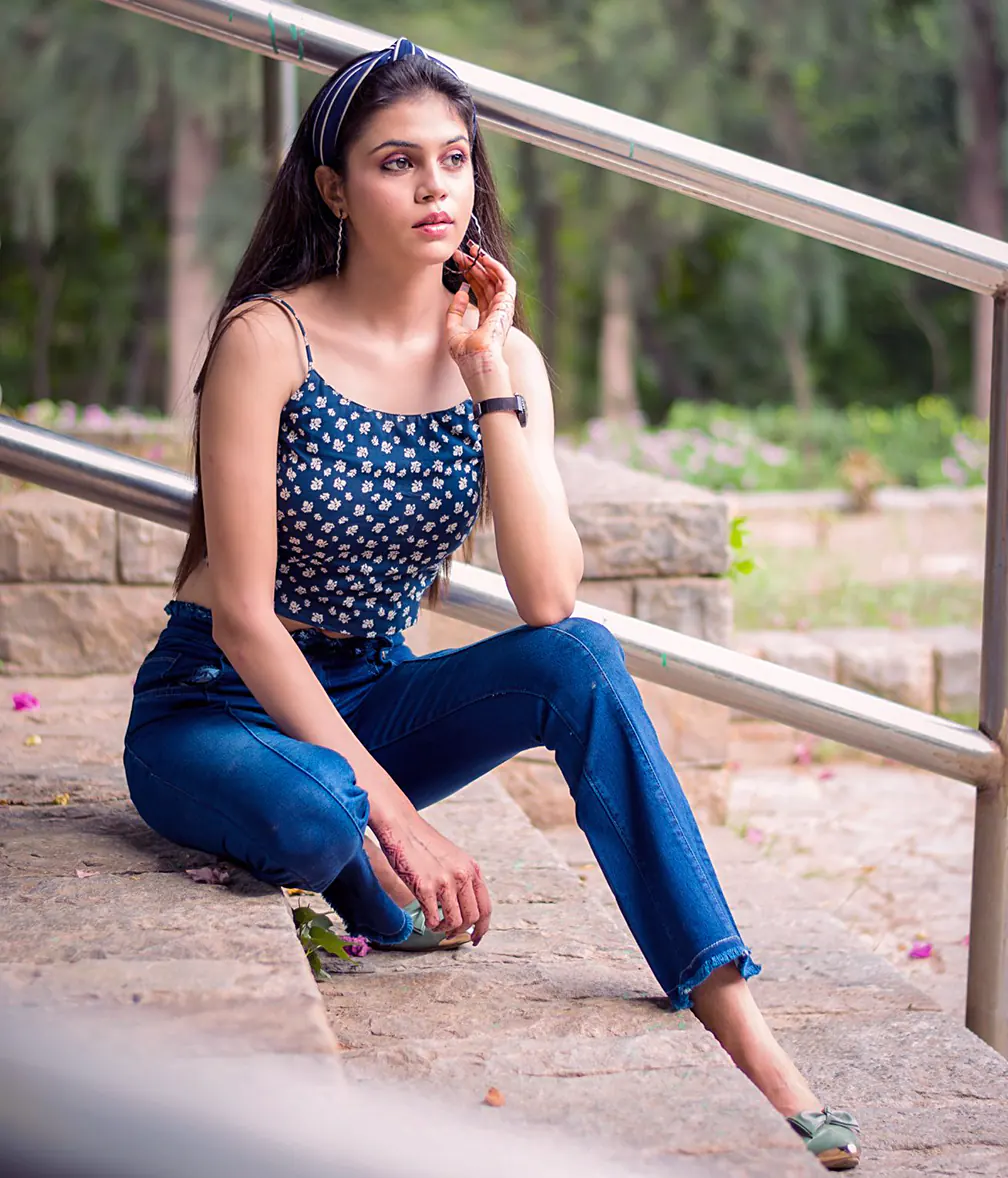 Sleeveless top with navy pants