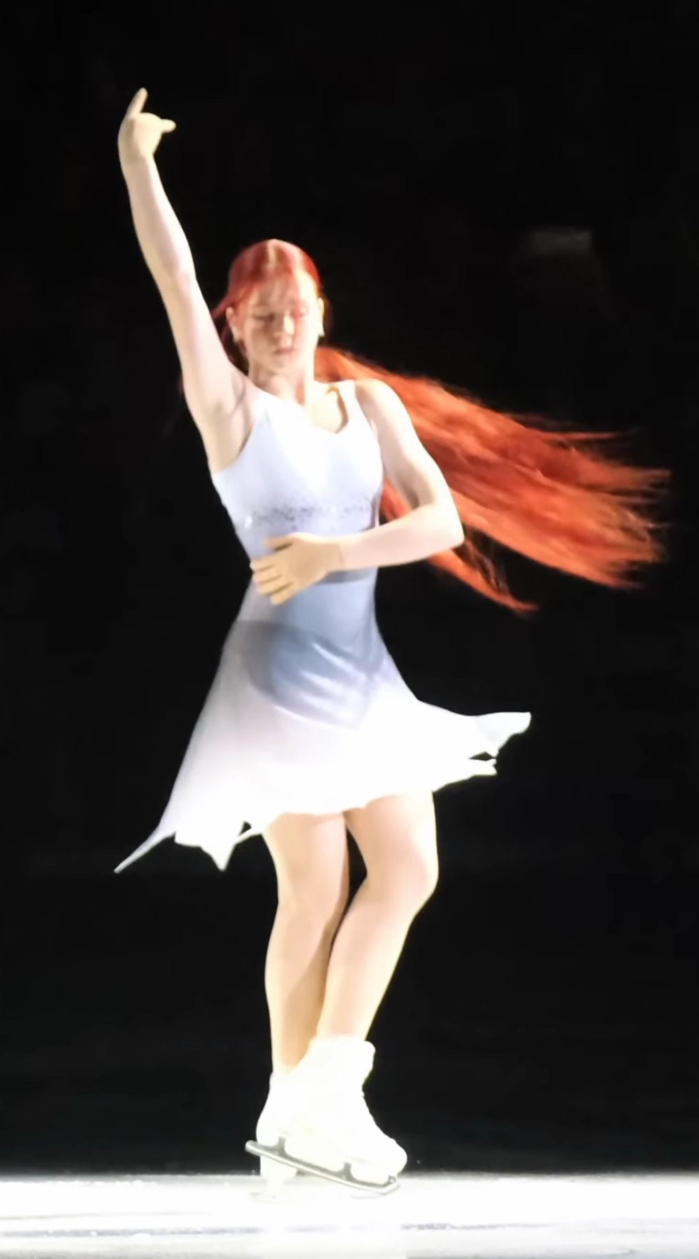 Female figure skater performing