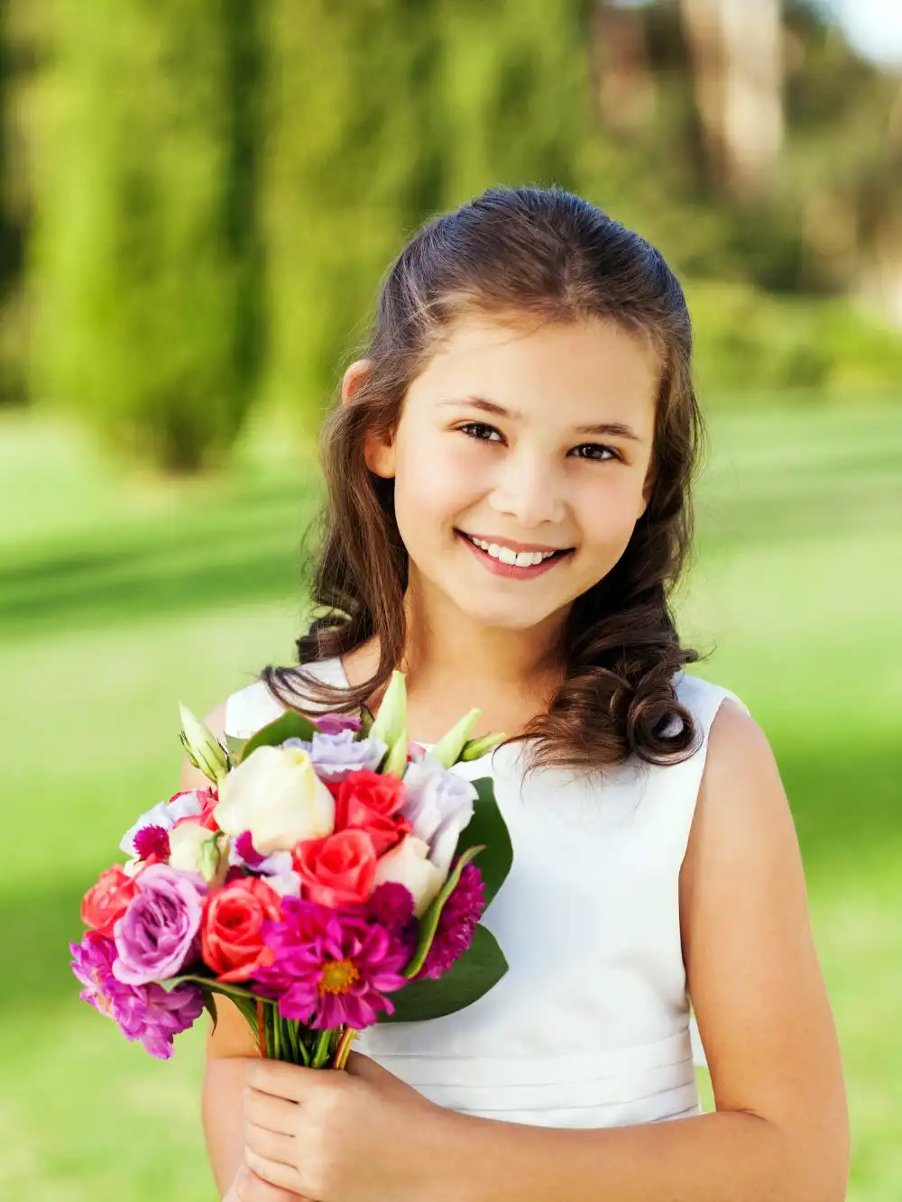 Cute flower girl wearing a white dress