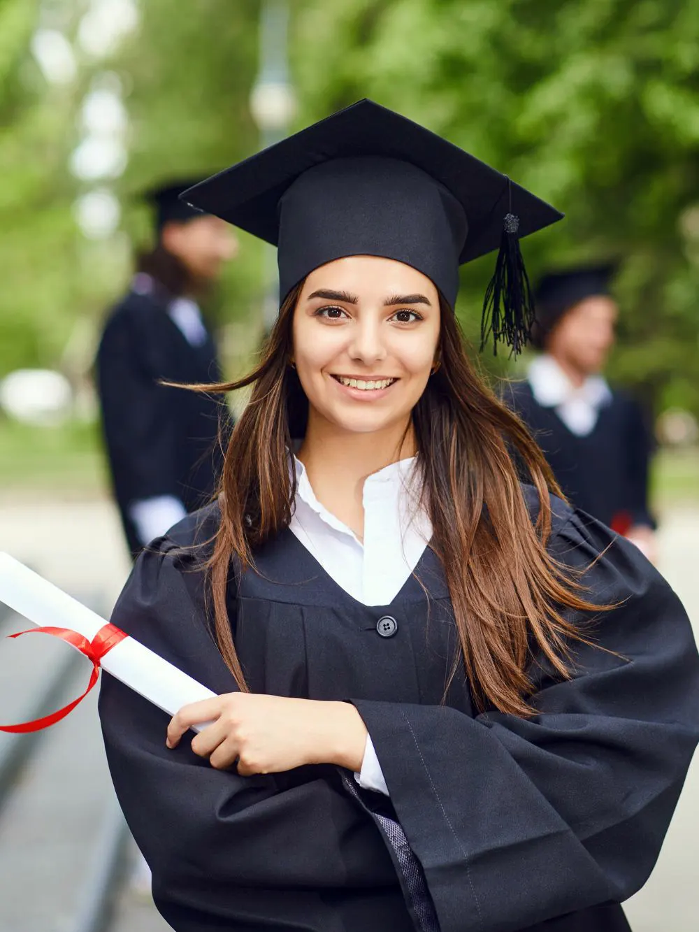 Girl wearing a white dress on graduation