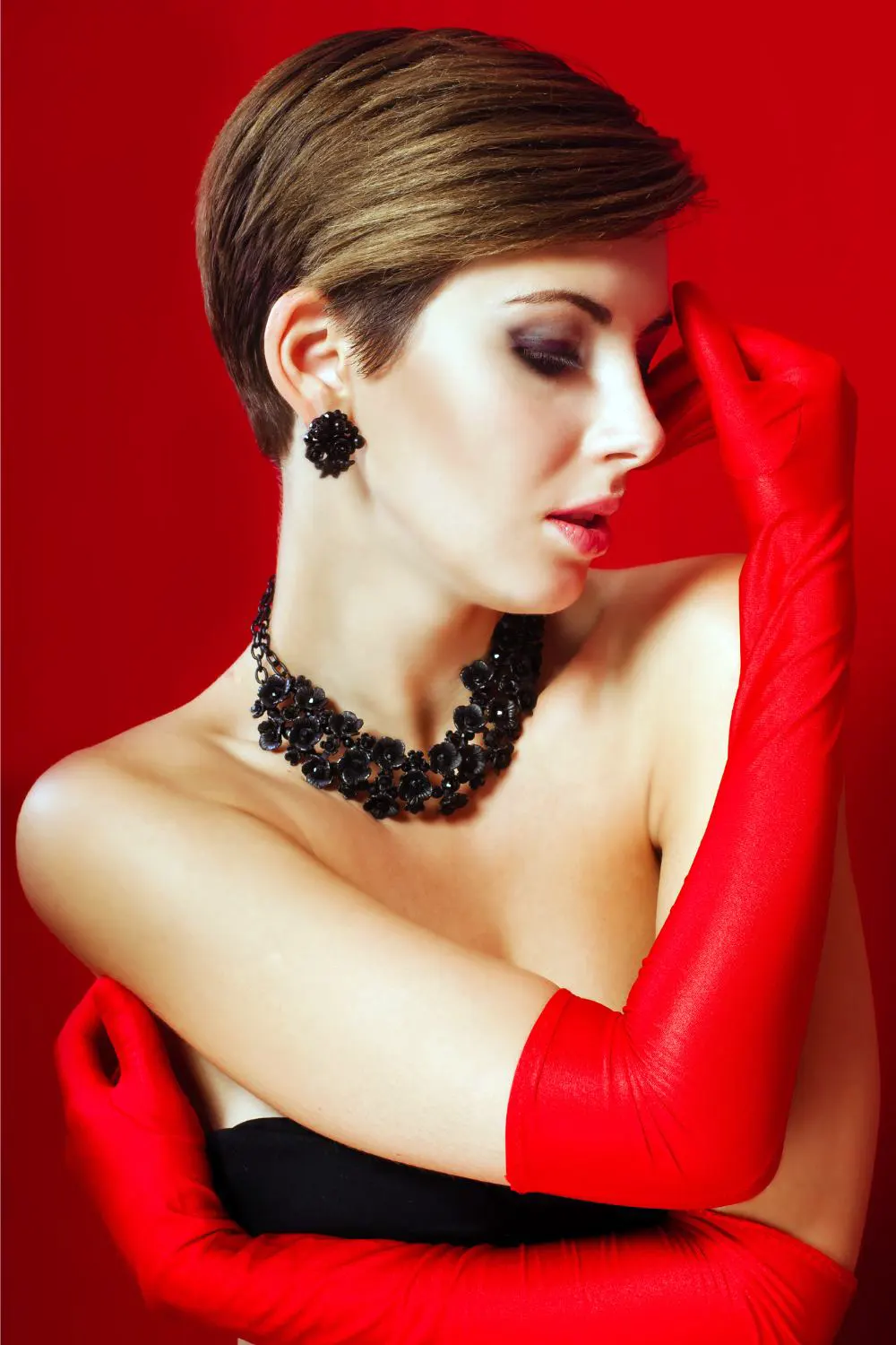 Beautiful girl in red gloves