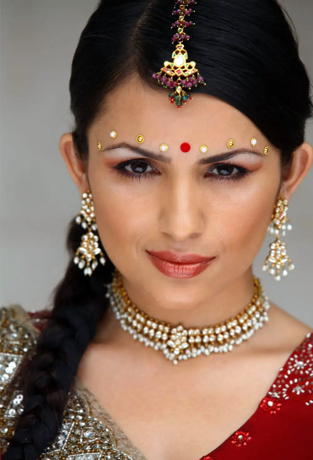 Beautiful woman with traditional bindi and maang tikka