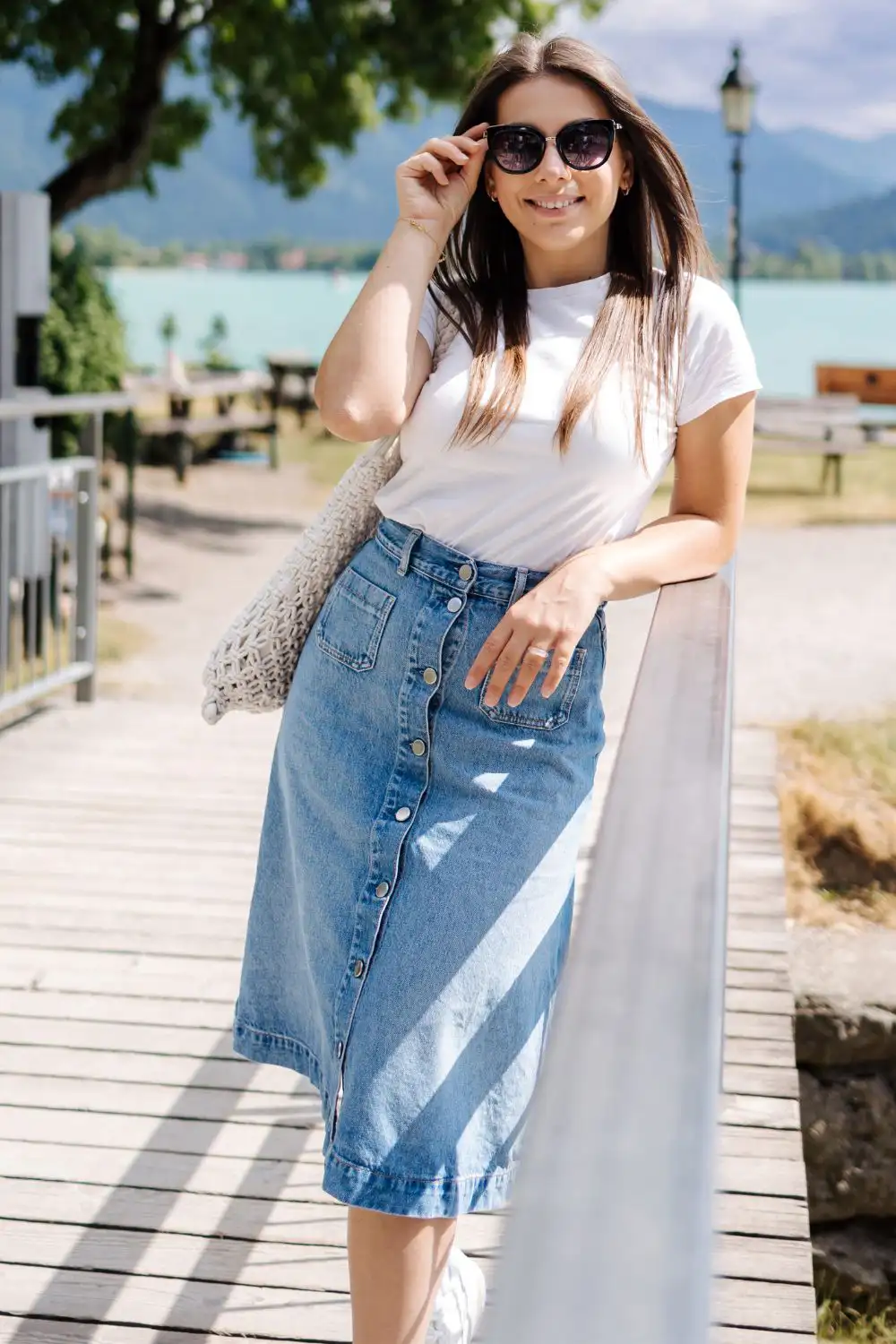 Elegant woman in long denim skirt