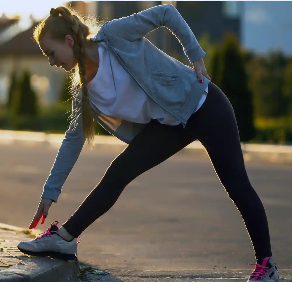 Young Woman Stretching Legs