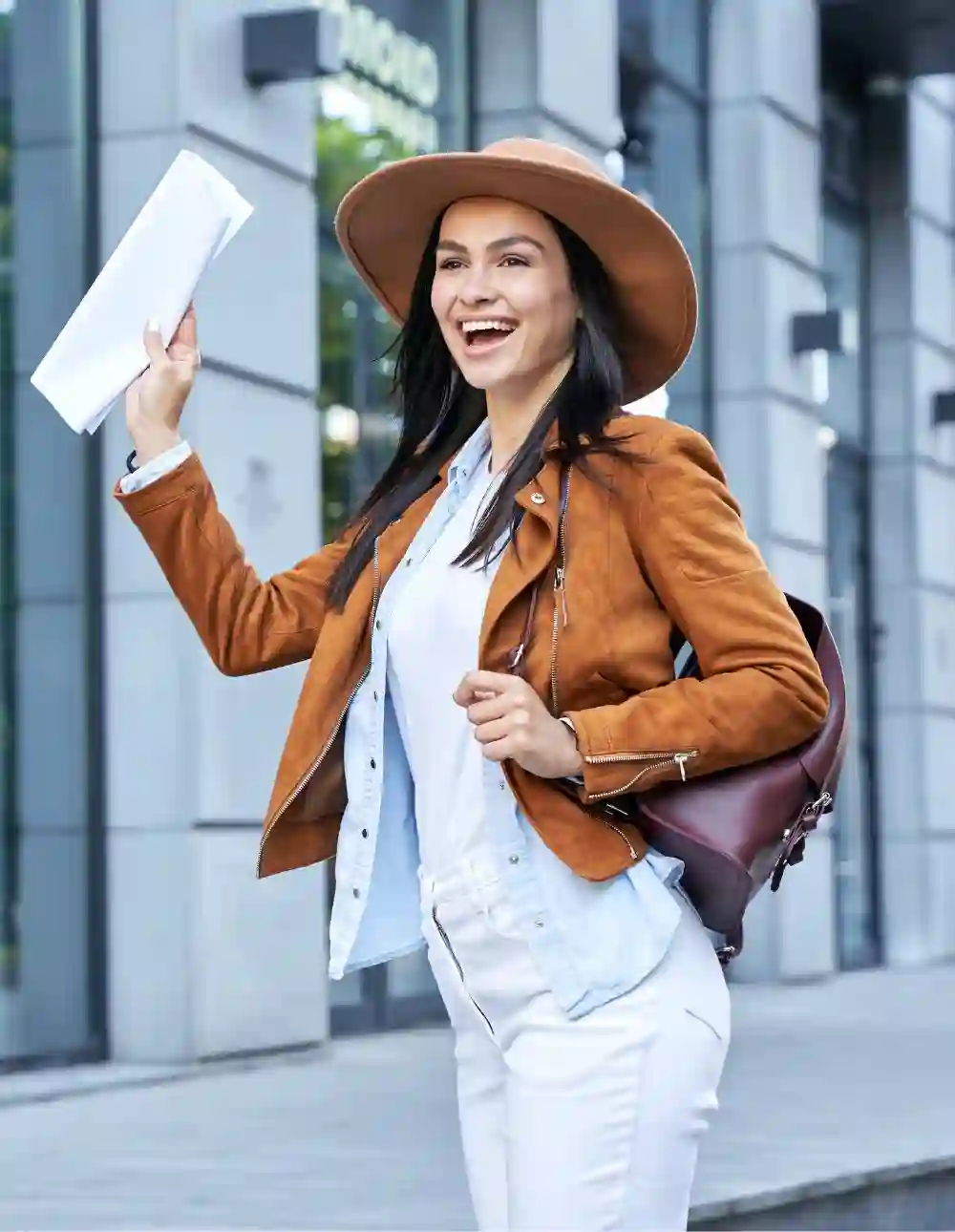 Lady in hat holding map outdoor