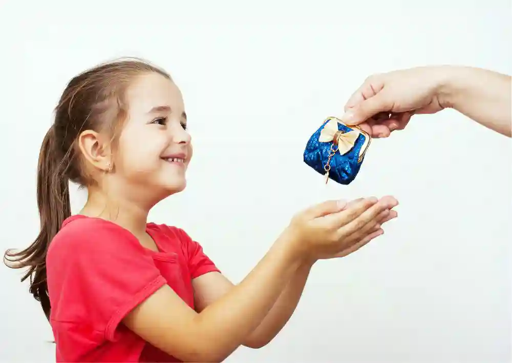 Mother gives the purse to a little girl