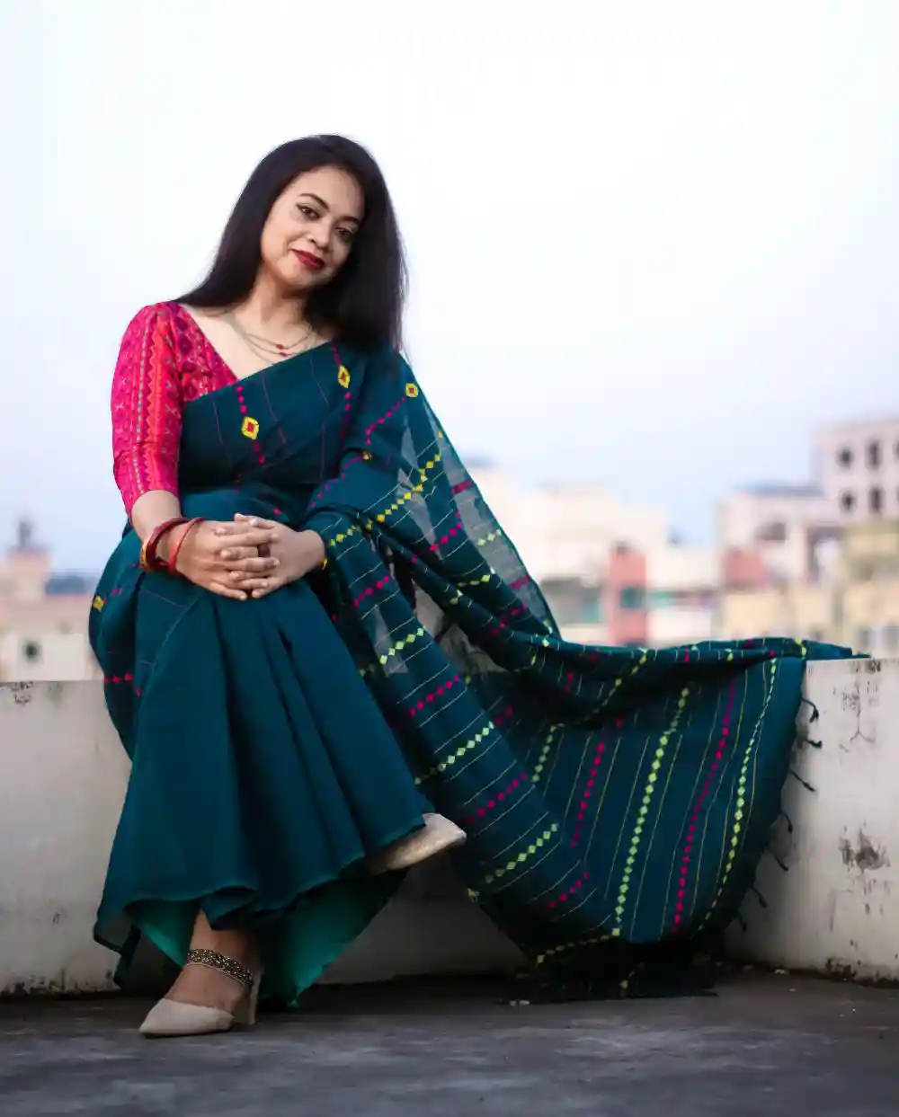 Woman Sitting Wearing Traditional Saree