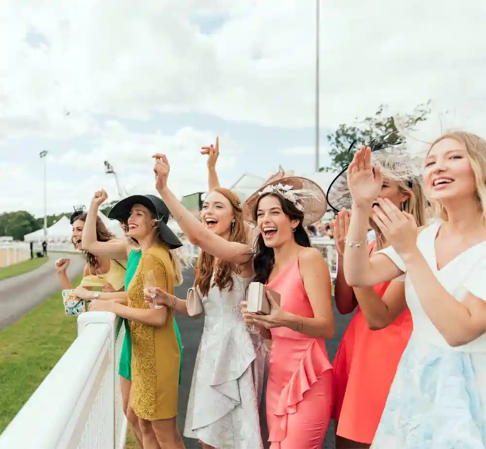 Ladies watching horses racing on the Kentucky Derby