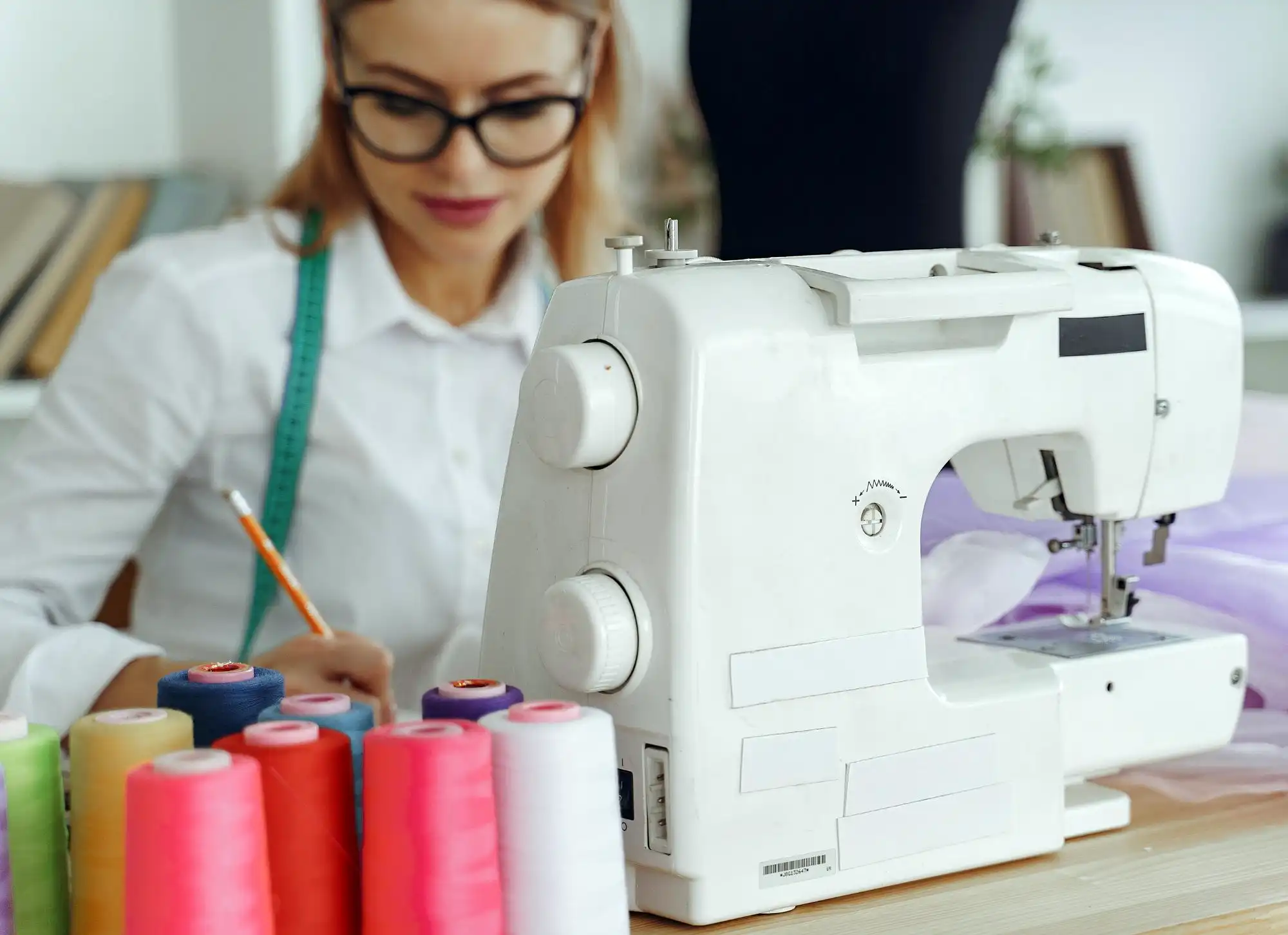 Dressmaker in front of her Sewing Machine