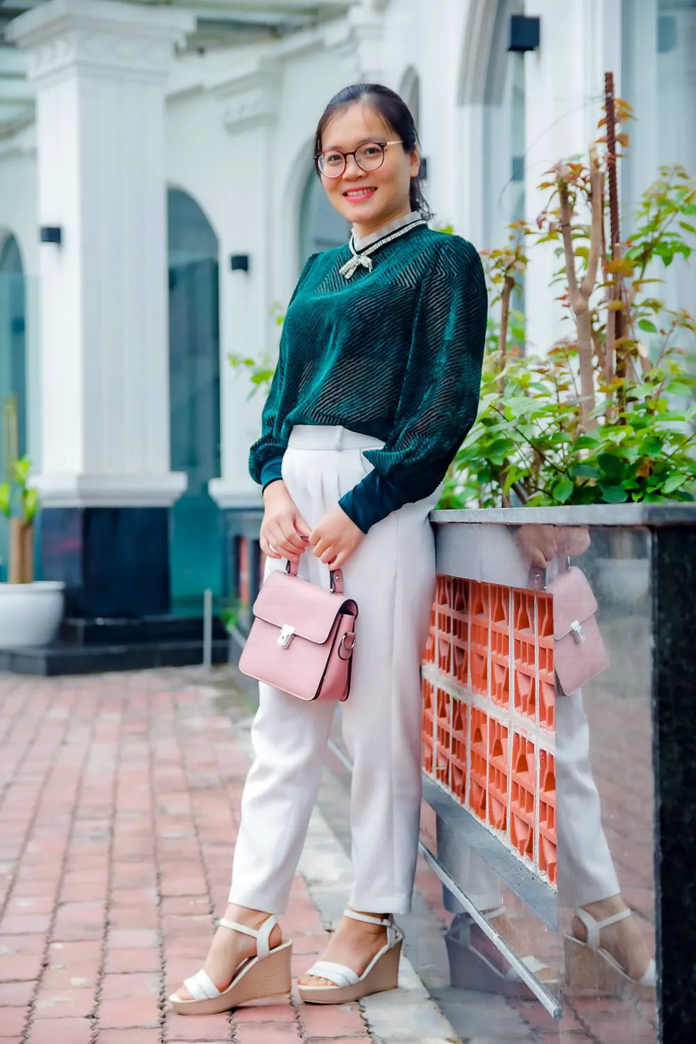 Woman in Green Long Sleeves Carrying Pink Handbag