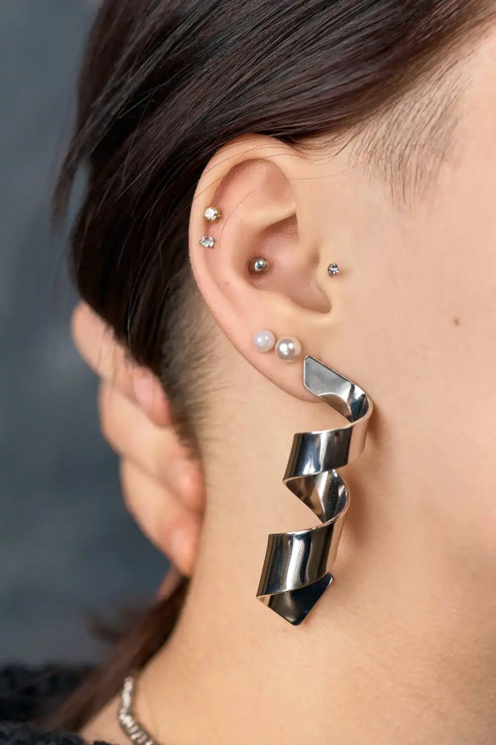 Deer stud earring on woman's ear