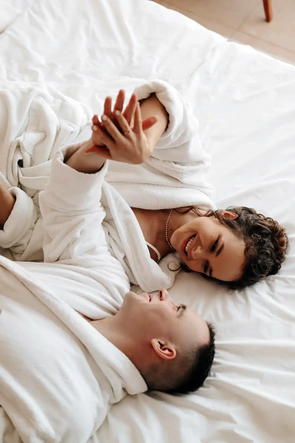 Couple Lying in Bed in Dressing Gowns