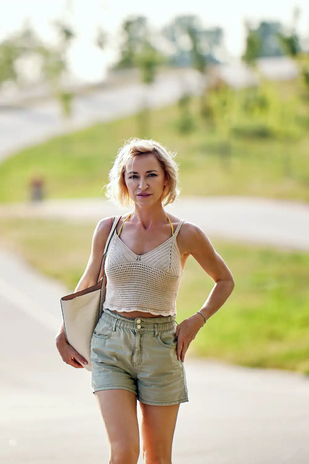 Woman dressed in shorts and sleeveless blouse