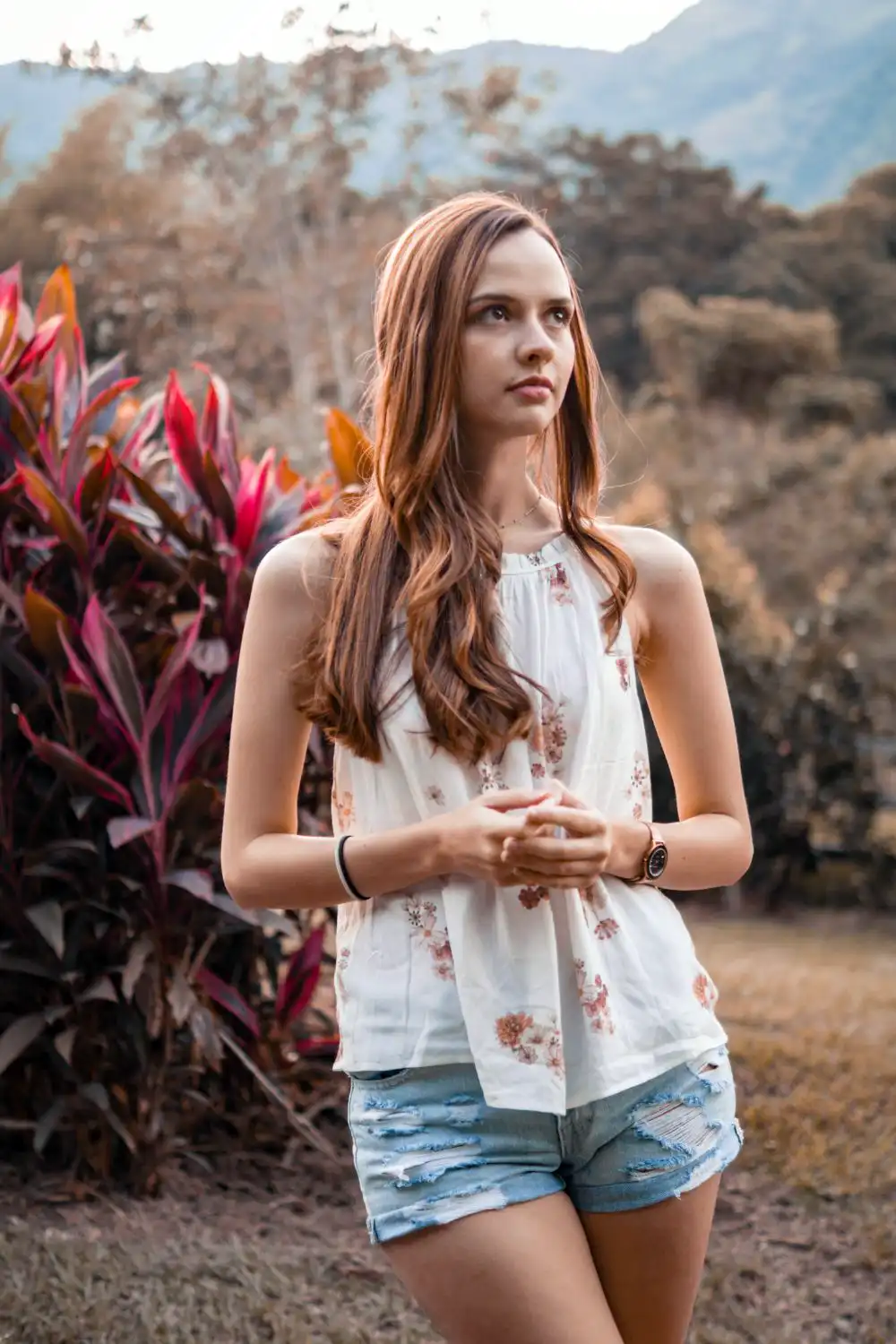 Woman in floral sleeveless blouse